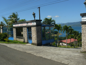 The security building and gated entrance are beside the paved road to Tronadora.